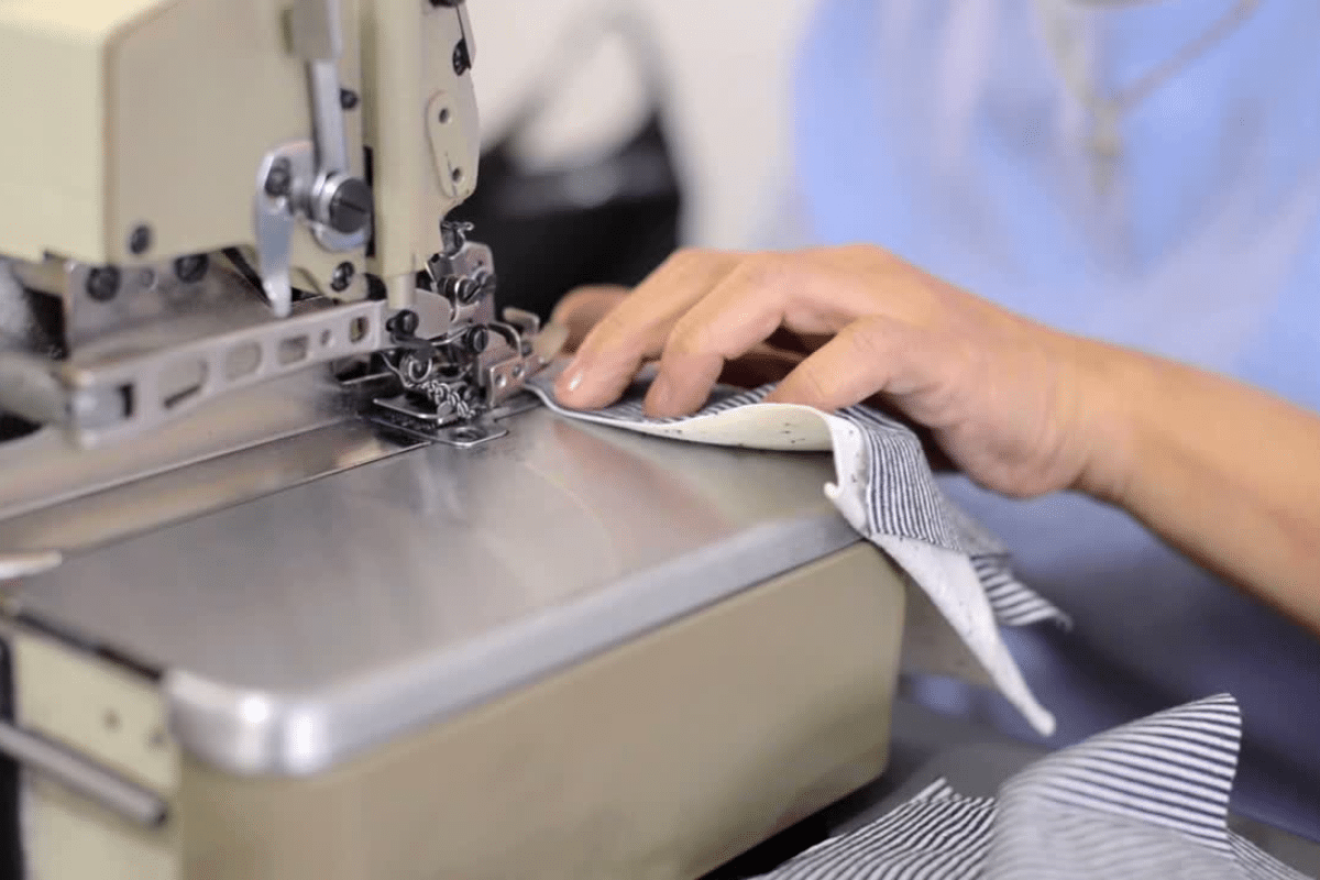 Streetwear Clothing Manufacturer sewing high-quality garments with precision stitching in production process